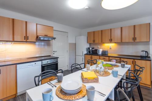 a kitchen with a table and chairs in it at Bookhouse apartment by Prague Castle in Prague