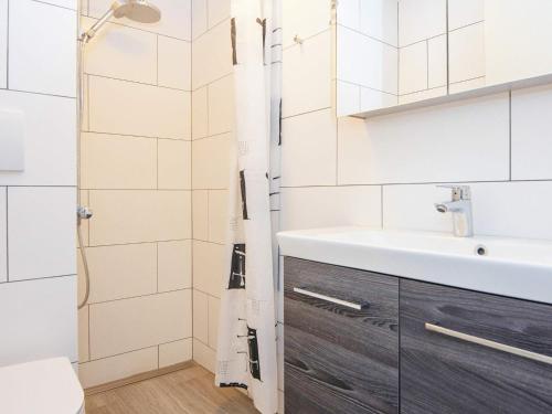 a bathroom with a sink and a toilet at 8 person holiday home in Ringkøbing-By Traum in Ringkøbing