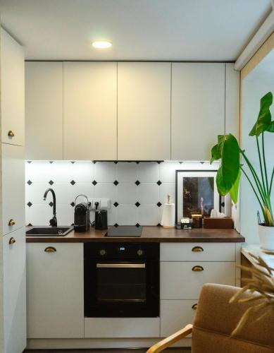 Dapur atau dapur kecil di Petite City Centre Apartment