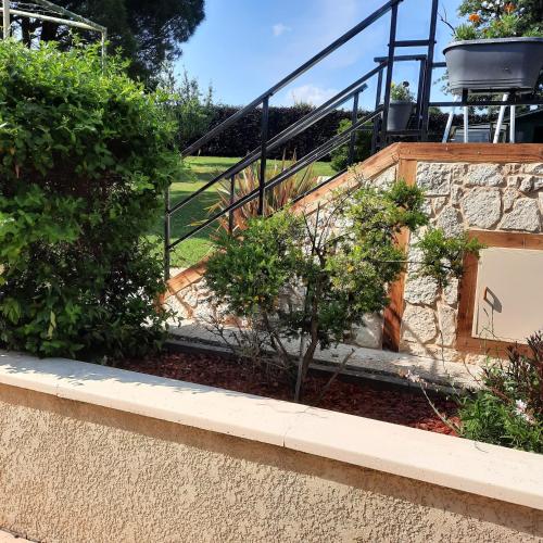 a set of stairs in a garden with plants at chambre AU DOUX REFUGE in Crans