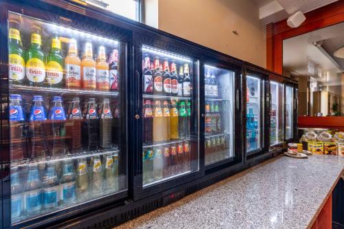 a refrigerator filled with lots of bottles of soda at DAS WESEL - DEIN HOTEL AM RHEIN in Oberwesel