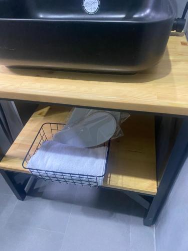 a shelf under a sink with a towel on it at Arevaham Boutique Hotel in Stepʼanavan
