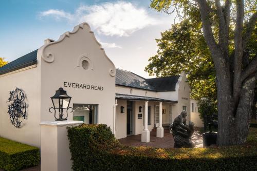 a building with a statue in front of it at Le Quartier Francais in Franschhoek