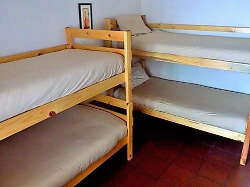 two bunk beds sitting next to each other in a room at Shark shacks in Mossel Bay