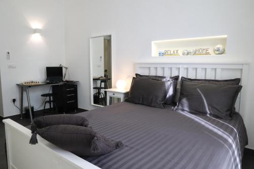 Postel nebo postele na pokoji v ubytování Bella 'Mbriana Home