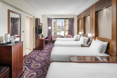 Postel nebo postele na pokoji v ubytování Elaf Kinda Hotel