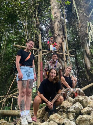a group of people posing for a picture on a bridge at NUANSA HOMESTAY Authentic&Hospitality in Rantepao