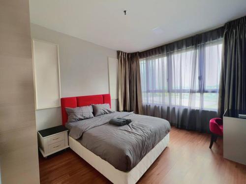 a bedroom with a bed and a large window at Comfy Staycation 4PX with Free Parking, Direct Linked SOGO & Central I-CITY in Shah Alam