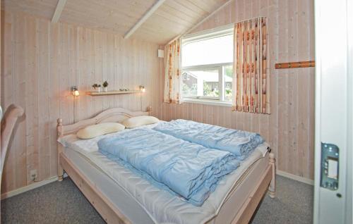 Llit o llits en una habitació de Beautiful Home In Juelsminde With 3 Bedrooms, Sauna And Wifi
