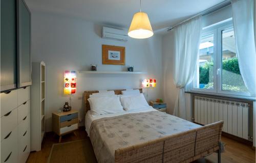 a bedroom with a large bed and a window at Stunning Apartment In Porto Santelpidio With Wifi in Porto SantʼElpidio