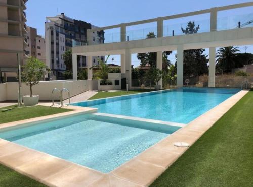 a large swimming pool in the middle of a building at Apartamento Calpe Beach in Calpe