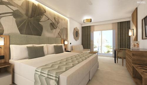 a bedroom with a large bed in a room at Riu Palace Mauritius - All Inclusive - Adults Only in Le Morne