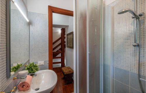 a bathroom with a sink and a shower and a mirror at Beautiful Apartment In Caramanico Terme With 4 Bedrooms in Caramanico Terme