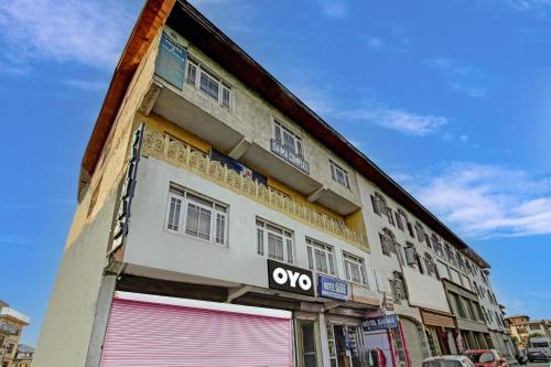 a building with an omo sign on the side of it at Hotel Saima in Srinagar