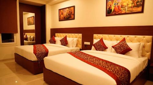 a hotel room with two beds in a room at Amer Valley in Jaipur