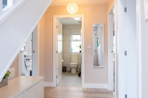 a bathroom with a toilet and a sink at Stylish 4 Bed, newly renovated home in Nottingham in Nottingham