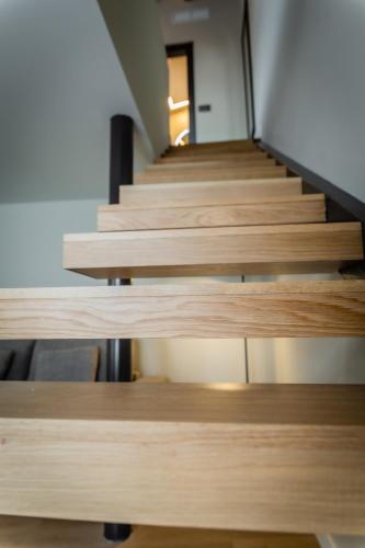 a set of wooden stairs in a building at HOTEL CORONA DE PADRÓN in Padrón