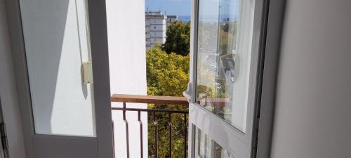 a balcony with a view of a city at Comfy room near Metro and Airport in Lisbon