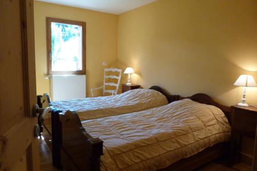 Katil atau katil-katil dalam bilik di Chalet avec du charme, 12 personnes, 4 chambres - CH24