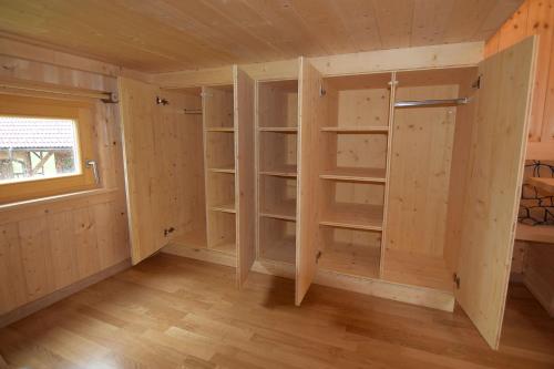 a room with wooden shelves in a room with a window at Esperanzahof in Oberndorf an der Melk