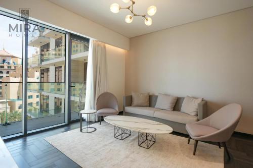 Posezení v ubytování Mira Holiday Homes - Cozy apartment in Al Jaddaf