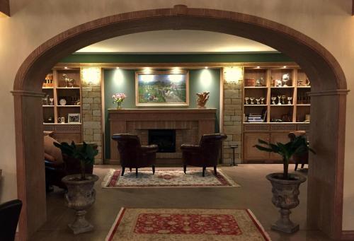 an archway in a living room with a fireplace at Agriturismo Il Boschetto in Ornago