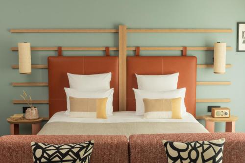 Hôtel Parc du Landreauにあるベッド