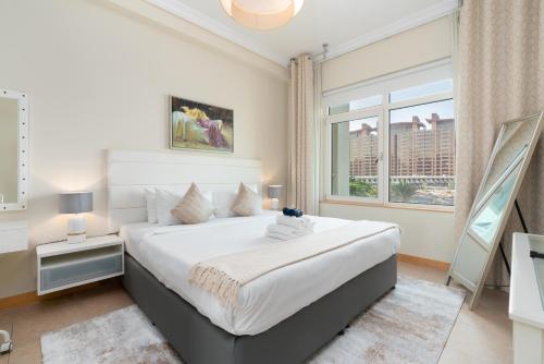Postel nebo postele na pokoji v ubytování Welcoming 1 Bedroom Palm Jumeirah with sea View