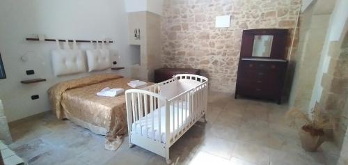 Ένα ή περισσότερα κρεβάτια σε δωμάτιο στο Salento Casa Vacanze con giardino privato