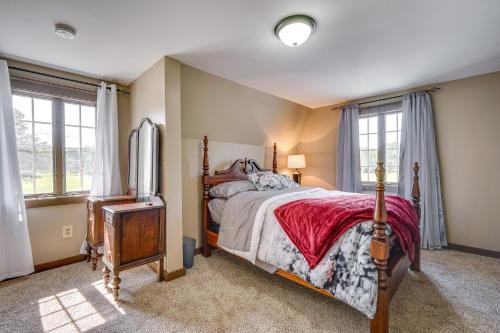 a bedroom with a bed and a tv in it at Buskirk Vacation Rental with Deck and Putting Green! in Buskirk