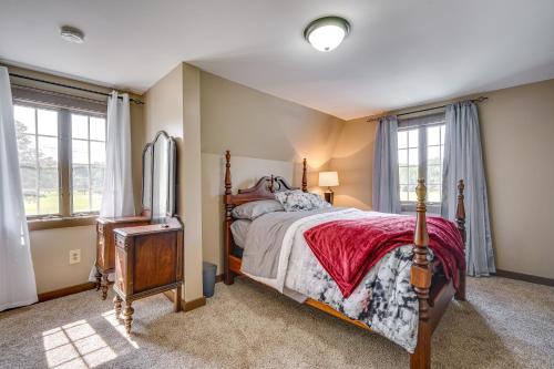 a bedroom with a bed and a tv in it at Buskirk Vacation Rental with Deck and Putting Green! 