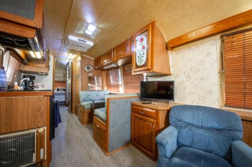 a kitchen and living room in an rv at Big Texan Airstream in Amarillo