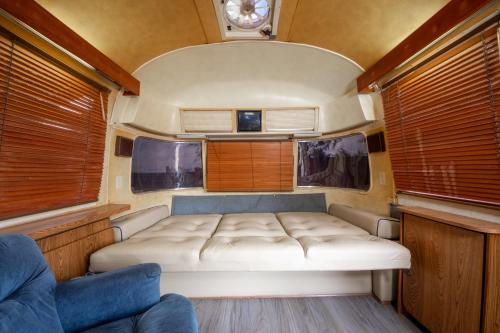 a small room with a bed in the middle at Big Texan Airstream in Amarillo