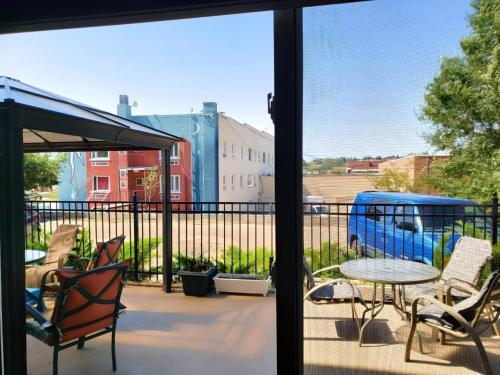 a view from a balcony with a table and chairs at The Medicine Hat Villa in Medicine Hat