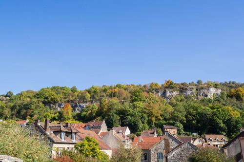 a town with houses and trees on a hill at Clos de belle roche in Saint-Romain