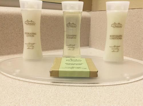 a tray with four products on a counter at Super 8 by Wyndham West Kelowna BC in West Kelowna