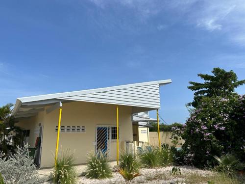 a small house with a metal roof at The Julianadorp Villas in Willemstad