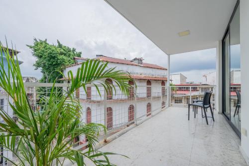 a balcony with a view of a building at La Moderna by Wynwood House in Panama City