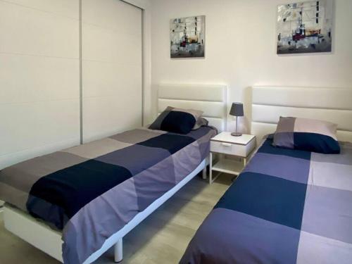 Krevet ili kreveti u jedinici u okviru objekta Casa de los Sueños - 2 bedroom modern apartment in Puerto del Carmen