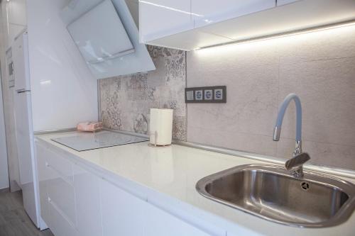 a kitchen with a sink and a counter top at VTAR Puerta Del Sol in Villacarrillo