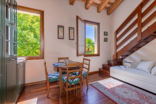 a living room with a table and a couch at Il Vivaio di Villa Grimani Morosini in Martellago