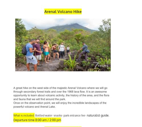 a group of people walking on a trail in the jungle at Alojamientos N&S in Fortuna