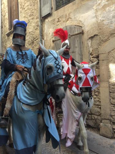 two men dressed in costumes standing next to a horse at SAUVEURS DE REVES 2 suites indépendantes et un F2 privé dans un hôtel particulier in Sauve