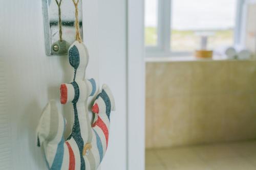 a pair of shoes hanging on a wall at Mornant in Trearddur
