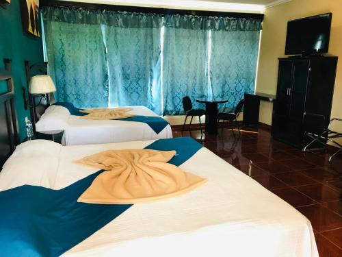 Ένα ή περισσότερα κρεβάτια σε δωμάτιο στο HOTEL PARAÍSO DEL VALLE