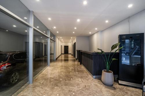 a hallway with a car parked in a building at La Vie Suite Madero in Buenos Aires