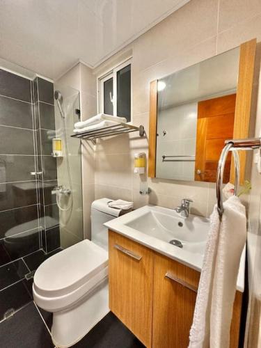 a bathroom with a sink and a toilet and a shower at Beautiful Condo in Bella Vista in Los Prados