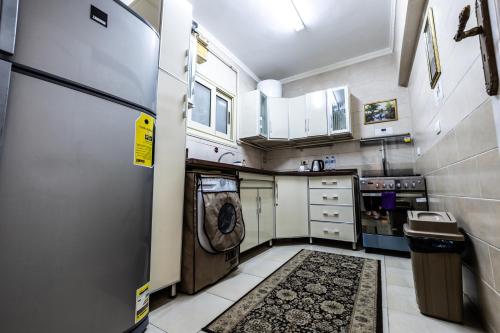 Η κουζίνα ή μικρή κουζίνα στο Gleem Luxury Apartments Elite