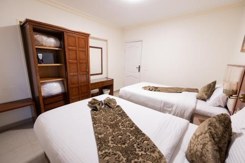 Ένα ή περισσότερα κρεβάτια σε δωμάτιο στο Gleem Luxury Apartments Elite