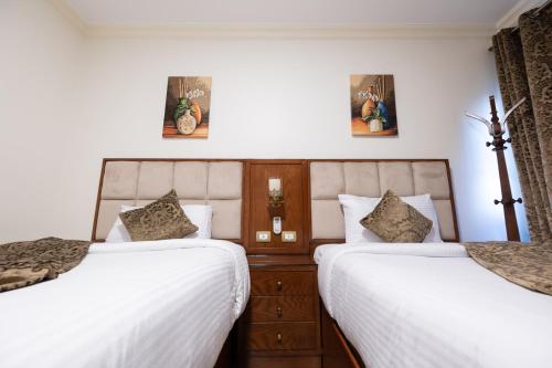 Ένα ή περισσότερα κρεβάτια σε δωμάτιο στο Gleem Luxury Apartments Elite